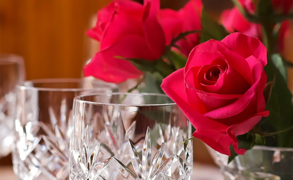 Roses and wine glasses, representing Mother's Day brunch in Los Angeles