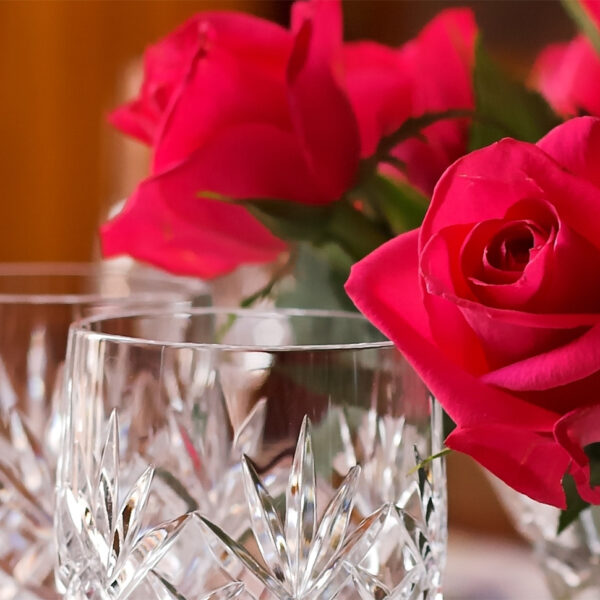 Roses and wine glasses, representing Mother's Day brunch in Los Angeles